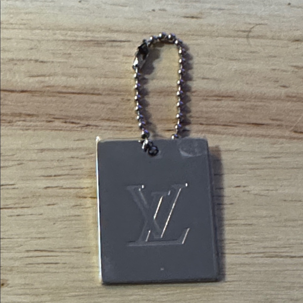Louis Vuitton silver supreme hang tag keychain purse charm key